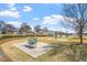 Playground with exercise equipment is situated near charming neighborhood homes and offers a great outdoor experience at 12 Beacon Ridge Blvd, Chapel Hill, NC 27516