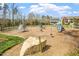 A community playground with various climbing structures and slides at 12 Beacon Ridge Blvd, Chapel Hill, NC 27516