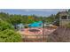 Community waterpark includes interactive splash pad, large pool, waterslide, tables with umbrellas, and plenty of trees at 12 Beacon Ridge Blvd, Chapel Hill, NC 27516