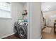 Convenient laundry room with modern washer and dryer, natural light, and storage space at 12404 Huntley Chase Dr, Durham, NC 27703