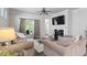 Cozy living room with fireplace and sliding glass doors to the rear patio at 12404 Huntley Chase Dr, Durham, NC 27703