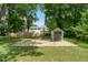 Backyard shed and swing set provides ample play or storage space at 1274 Candlewood Dr, Elon, NC 27244