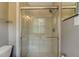 Contemporary bathroom featuring a glass-enclosed shower with tile surround and modern fixtures at 1274 Candlewood Dr, Elon, NC 27244