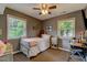 Cozy bedroom with a twin bed, bright windows, and comfortable carpeting, perfect for relaxation at 1274 Candlewood Dr, Elon, NC 27244