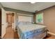Tranquil bedroom featuring a queen bed, soft lighting, and bright windows for a peaceful ambiance at 1274 Candlewood Dr, Elon, NC 27244