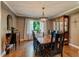 Traditional dining room with hardwood floors, elegant chandelier, and hutch at 1274 Candlewood Dr, Elon, NC 27244