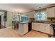 Classic kitchen with white cabinetry, stainless steel appliances and tile flooring at 1274 Candlewood Dr, Elon, NC 27244