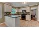 Classic kitchen with white cabinetry, stainless steel appliances and tile flooring at 1274 Candlewood Dr, Elon, NC 27244