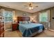 Serene main bedroom with a plush bed, soft lighting, and bright windows for a relaxing atmosphere at 1274 Candlewood Dr, Elon, NC 27244