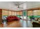 Bright sunroom featuring a comfortable seating area, and large windows showcasing the outdoor scenery at 1274 Candlewood Dr, Elon, NC 27244