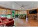 Enclosed sunroom with brick accents, comfortable seating and backyard views at 1274 Candlewood Dr, Elon, NC 27244
