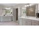 Spacious bathroom with double vanities, a large mirror, and a view of the shower at 1312 Glenden Falls Way, Raleigh, NC 27614