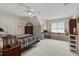Bright bedroom featuring a window, dresser, and striped comforter at 1312 Glenden Falls Way, Raleigh, NC 27614