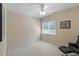 Bright bedroom with a large window, plush carpeting, and a chair at 1312 Glenden Falls Way, Raleigh, NC 27614