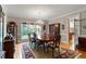 Traditional dining room with hardwood floors, large windows, chandelier, and classic furniture at 1312 Glenden Falls Way, Raleigh, NC 27614