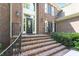 Inviting brick home entrance with an elegant front door and meticulously maintained landscaping at 1312 Glenden Falls Way, Raleigh, NC 27614