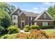 Beautiful brick home featuring a manicured lawn and mature landscaping for great curb appeal at 1312 Glenden Falls Way, Raleigh, NC 27614