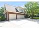 Three car garage and spacious driveway on a lovely brick home surrounded by mature trees at 1312 Glenden Falls Way, Raleigh, NC 27614