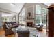 Inviting living room with fireplace, large arched windows, and comfortable seating at 1312 Glenden Falls Way, Raleigh, NC 27614