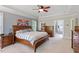 The spacious main bedroom has natural light and wood furnishings at 1312 Glenden Falls Way, Raleigh, NC 27614