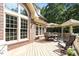 Lovely outdoor patio with a table, umbrella, chairs, and a gazebo with chairs; perfect for entertaining guests at 1312 Glenden Falls Way, Raleigh, NC 27614