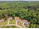 A stunning aerial view shows homes nestled among mature trees, offering a sense of privacy at 1344 Legend Oaks Drive Dr, Chapel Hill, NC 27517