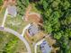 A high angle aerial view of a residential street with well-manicured lawns and mature trees at 1344 Legend Oaks Drive Dr, Chapel Hill, NC 27517