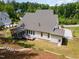 Aerial view of backyard, screened in porch, and back of the house at 1344 Legend Oaks Drive Dr, Chapel Hill, NC 27517