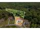 A spectacular aerial view shows the generous lot, surrounded by mature trees offering privacy at 1344 Legend Oaks Drive Dr, Chapel Hill, NC 27517