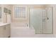 Bright bathroom features a soaking tub and a tiled shower with glass doors at 1344 Legend Oaks Drive Dr, Chapel Hill, NC 27517