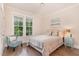 Comfortable bedroom with a double windows and neutral decor at 1344 Legend Oaks Drive Dr, Chapel Hill, NC 27517