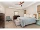 Cozy bedroom with a ceiling fan, padded bench, and natural light at 1344 Legend Oaks Drive Dr, Chapel Hill, NC 27517