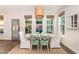 Cozy dining area with natural light, rustic table, and wood floors at 1344 Legend Oaks Drive Dr, Chapel Hill, NC 27517