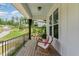 Cozy front porch offers chairs and a railing overlooking the surrounding landscape at 1344 Legend Oaks Drive Dr, Chapel Hill, NC 27517