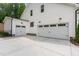 Spacious three-car garage with white doors and concrete driveway at 1344 Legend Oaks Drive Dr, Chapel Hill, NC 27517