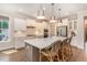 Modern kitchen with island, quartz countertops, pendant lights, and stainless appliances at 1344 Legend Oaks Drive Dr, Chapel Hill, NC 27517