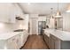 Gourmet kitchen with white cabinets, farmhouse sink, and stainless steel appliances at 1344 Legend Oaks Drive Dr, Chapel Hill, NC 27517