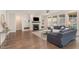 Spacious living room with a fireplace, built-in shelving, and hardwood floors at 1344 Legend Oaks Drive Dr, Chapel Hill, NC 27517