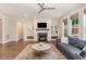 Inviting living room boasts a fireplace, built-in shelving, and hardwood floors at 1344 Legend Oaks Drive Dr, Chapel Hill, NC 27517