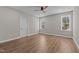 Empty bedroom features wood floors, fresh paint, and windows at 1430 Clifton Pond Rd, Louisburg, NC 27549