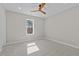 Bright bedroom featuring a ceiling fan, and a window with natural light at 1430 Clifton Pond Rd, Louisburg, NC 27549