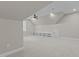 This bonus room offers a ceiling fan, recessed lighting, neutral walls and carpet, and built in shelving at 1430 Clifton Pond Rd, Louisburg, NC 27549