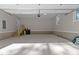 This spacious garage includes stairs to additional storage space and an automatic door at 1430 Clifton Pond Rd, Louisburg, NC 27549