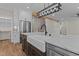 Stylish kitchen with farmhouse sink, stainless steel appliances, and marble countertops on a dark wood island at 1430 Clifton Pond Rd, Louisburg, NC 27549