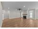 Bright living room features a fireplace with wood mantle and ample space for entertaining at 1430 Clifton Pond Rd, Louisburg, NC 27549