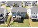Aerial view of the home's backyard, featuring the deck, patio, and play area at 155 Annabelle Branch Ln, Apex, NC 27523