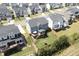 Aerial view shows the backyard with play set, the deck, and the surrounding neighborhood at 155 Annabelle Branch Ln, Apex, NC 27523