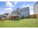 Spacious backyard featuring a screened porch and a well-maintained lawn, creating a relaxing outdoor space at 155 Annabelle Branch Ln, Apex, NC 27523