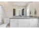 Bathroom featuring granite countertops, white cabinets, and a large mirror at 155 Annabelle Branch Ln, Apex, NC 27523