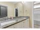 Bathroom with double sinks, granite countertops, and view of a tub/shower combination at 155 Annabelle Branch Ln, Apex, NC 27523